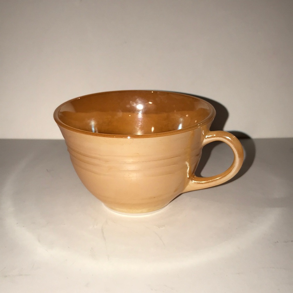 Vintage Fire King peach lustre teacup
